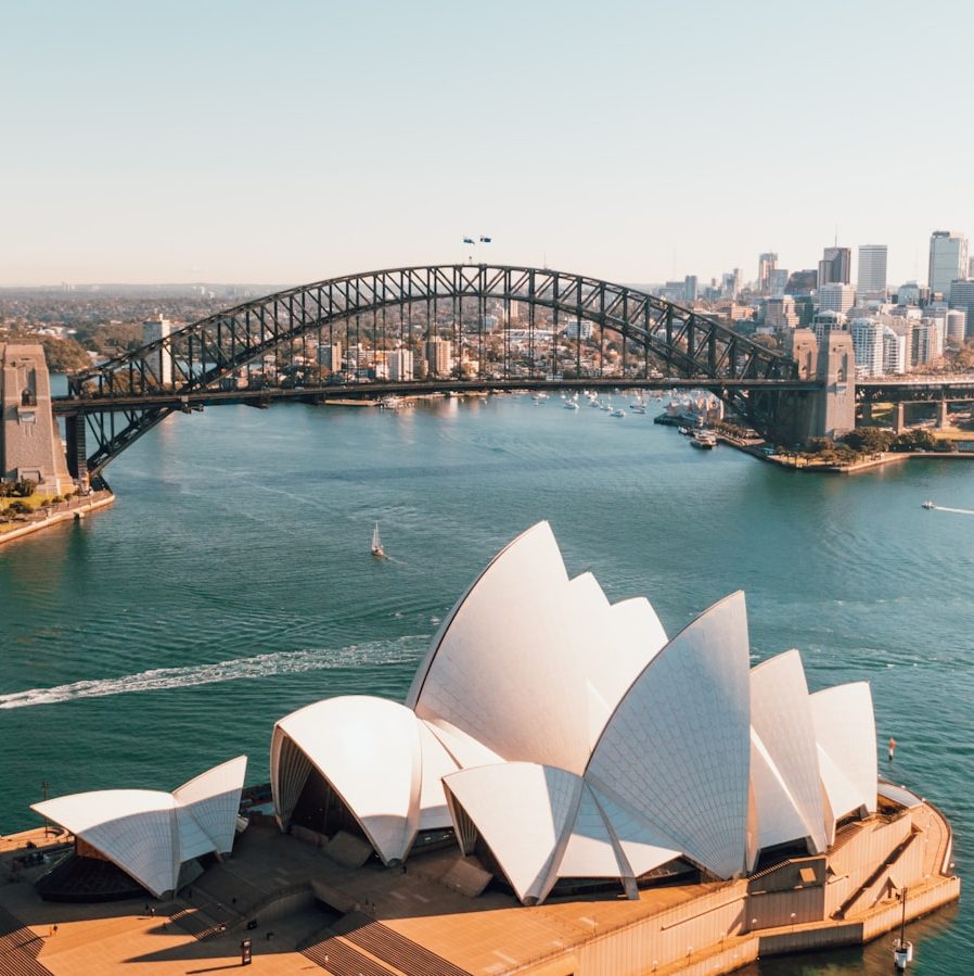 sydney opera house near body of water during daytime